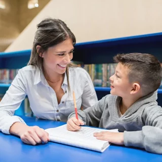 teacher-and-student-at-library-xlarge